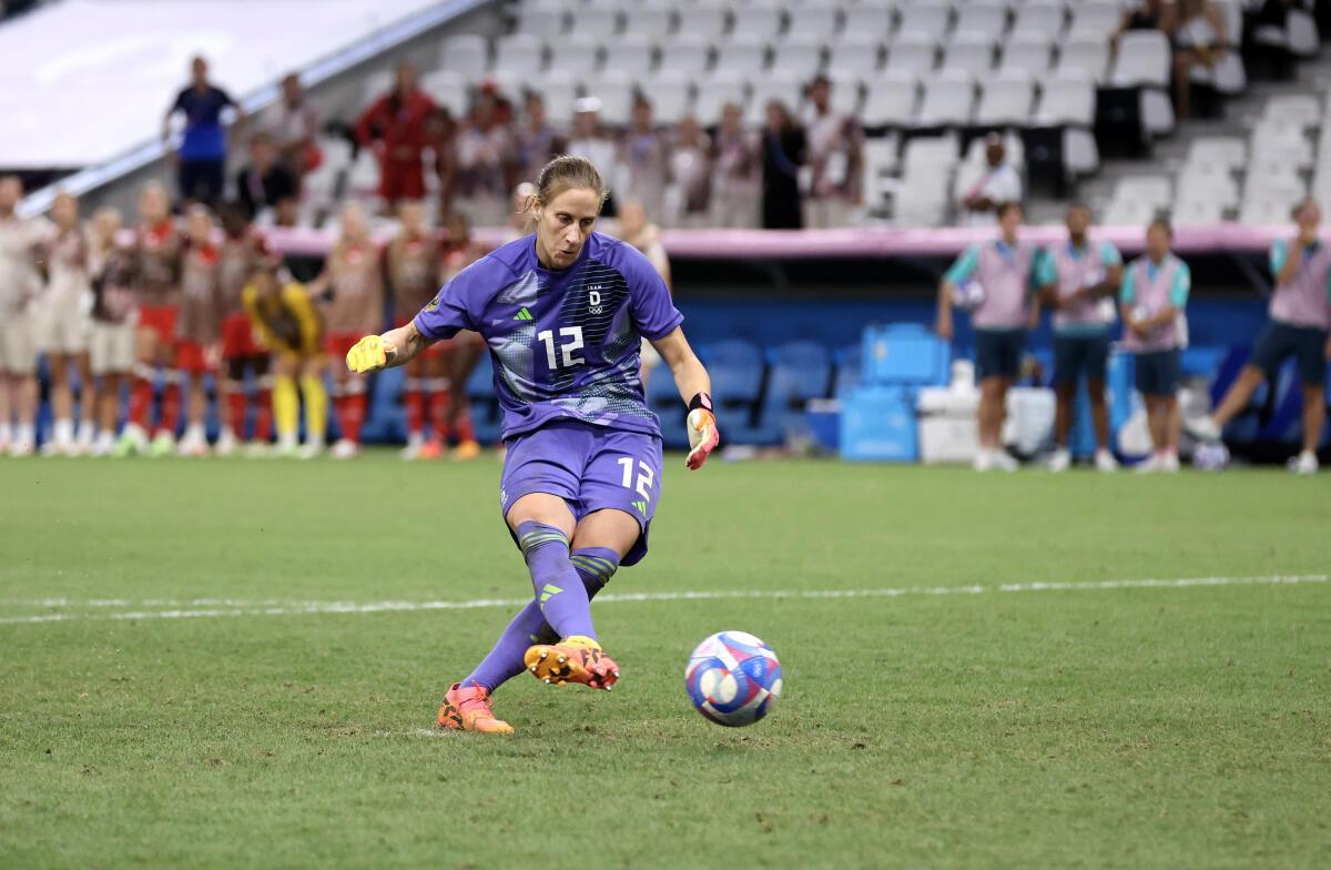 Ann-Katrin Berger of Team Germany scores the team’s fifth and winner penalty in the penalty shoot out against Canada