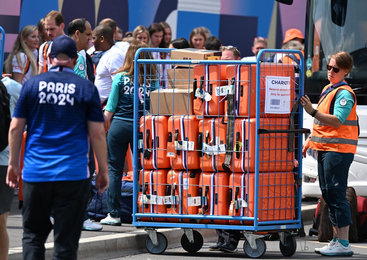 Luggages of players being taken inside the Games Village in Paris.