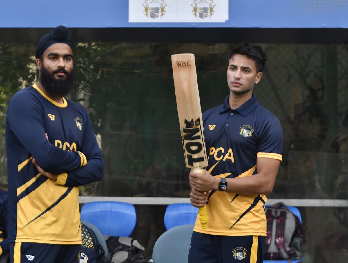 Punjab’s Abhishek Sharma (right) and Jass Inder Singh during a practice session on the eve of Syed Mushtaq Ali T20 trophy Cricket match final at IS Bindra Stadium, Mohali.