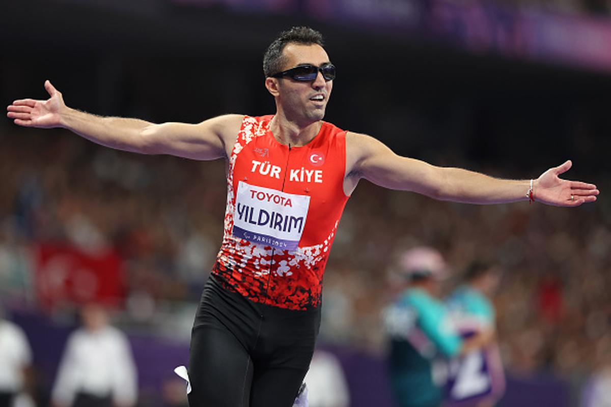 Turkiye’s Serkan Yildirim celebrates after winning the Men’s 100m T12 gold medal at Paris Paralympics.