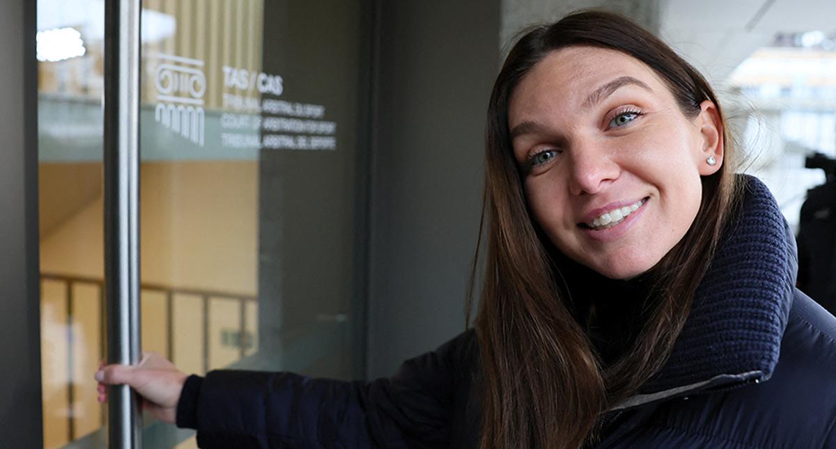 Romanian tennis player Simona Halep smiles after talking to the media, on the hearing day of a doping case against her at the Court of Arbitration for Sport (CAS) in Lausanne, Switzerland, on February 9, 2024. 