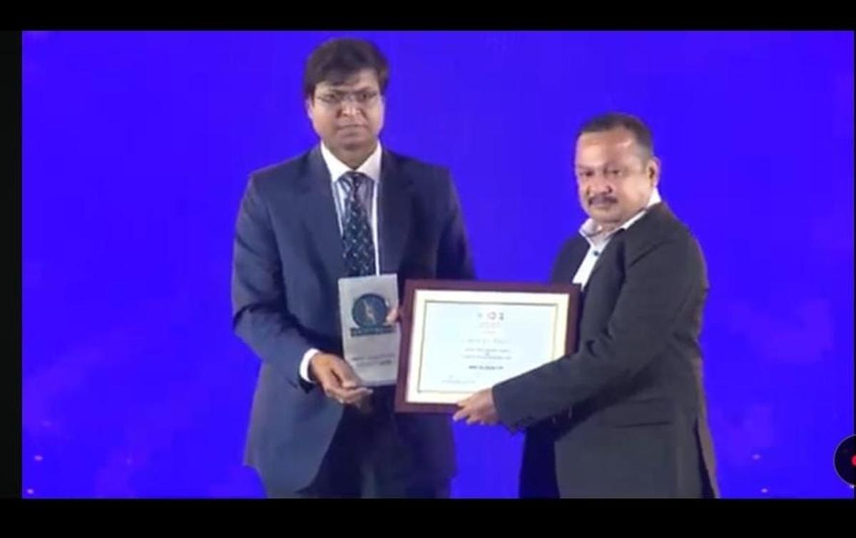 Anil Kumar receiving the citation from Dilip Tirkey, president of Hockey India in the Hockey India’s awards function in New Delhi on March 15.