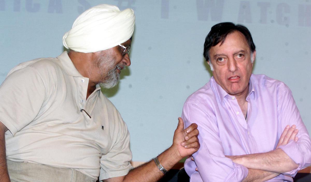 Bedi in conversation with ‘Tiger’ Pataudi in New Delhi on July 10, 2002.