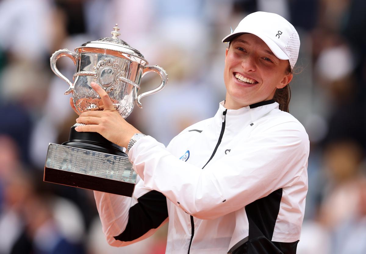 Poland’s Iga Swiatek with the Suzanne-Lenglen Cup after winning the women’s singles title at French Open in 2023.