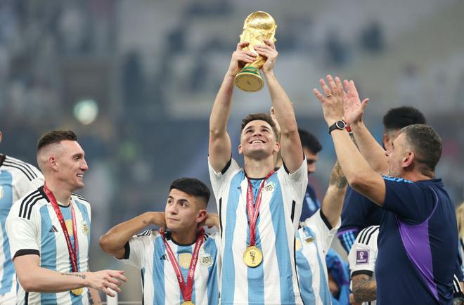 Julian Alvarez of Argentina celebrates with The FIFA World Cup Qatar 2022 Winner’s Trophy after winning the FIFA World Cup Qatar 2022 Final match between Argentina and France at Lusail Stadium.