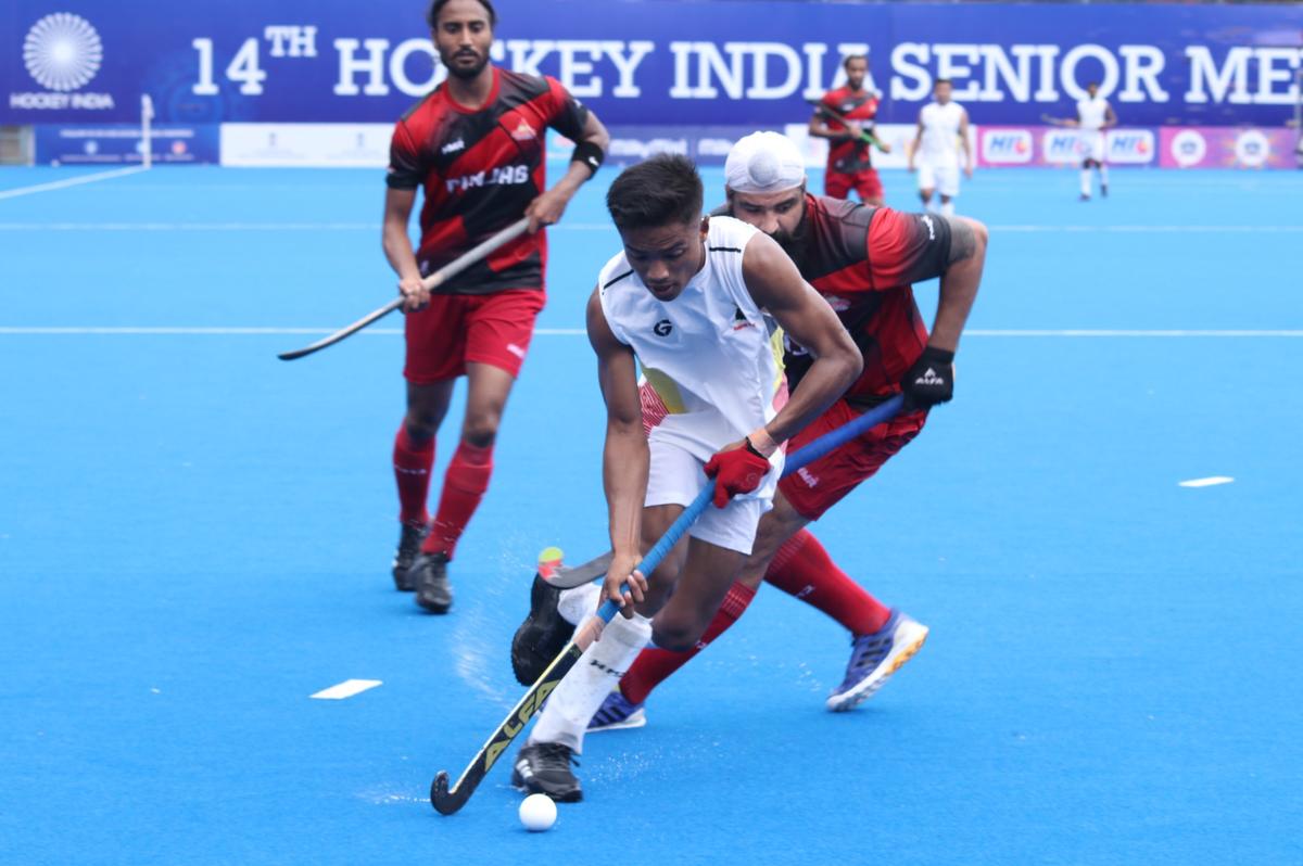 Manipur in action against Punjab at the Mayor Radhakrishnan Hockey Stadium on Wednesday. 