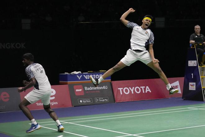 India‘s Satwiksairaj Rankireddy (left) and Chirag Shetty react after winning over Indonesia’s Kevin Sanjaya and Mohammad Ahsan during their men’s double final badminton match at Thomas & Uber Cup in Bangkok, Thailand. 