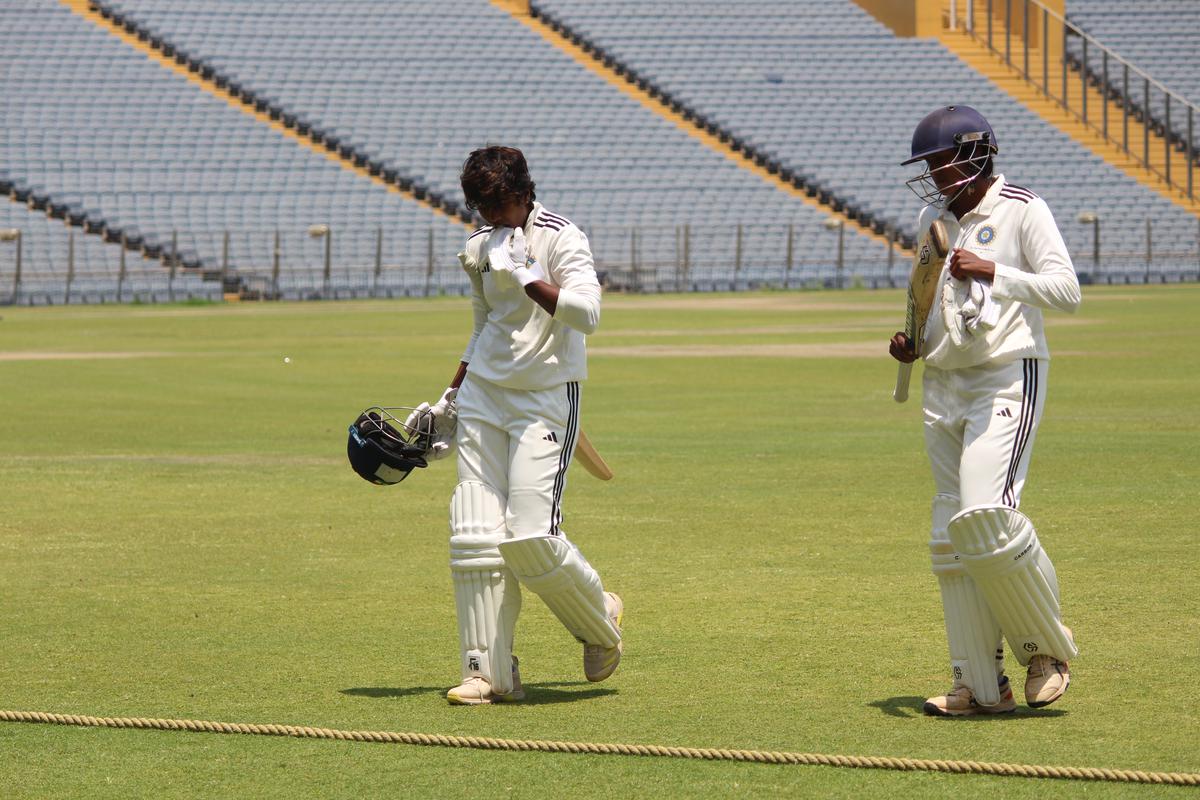 South’s Arundhati Reddy and S Anusha make their way out.