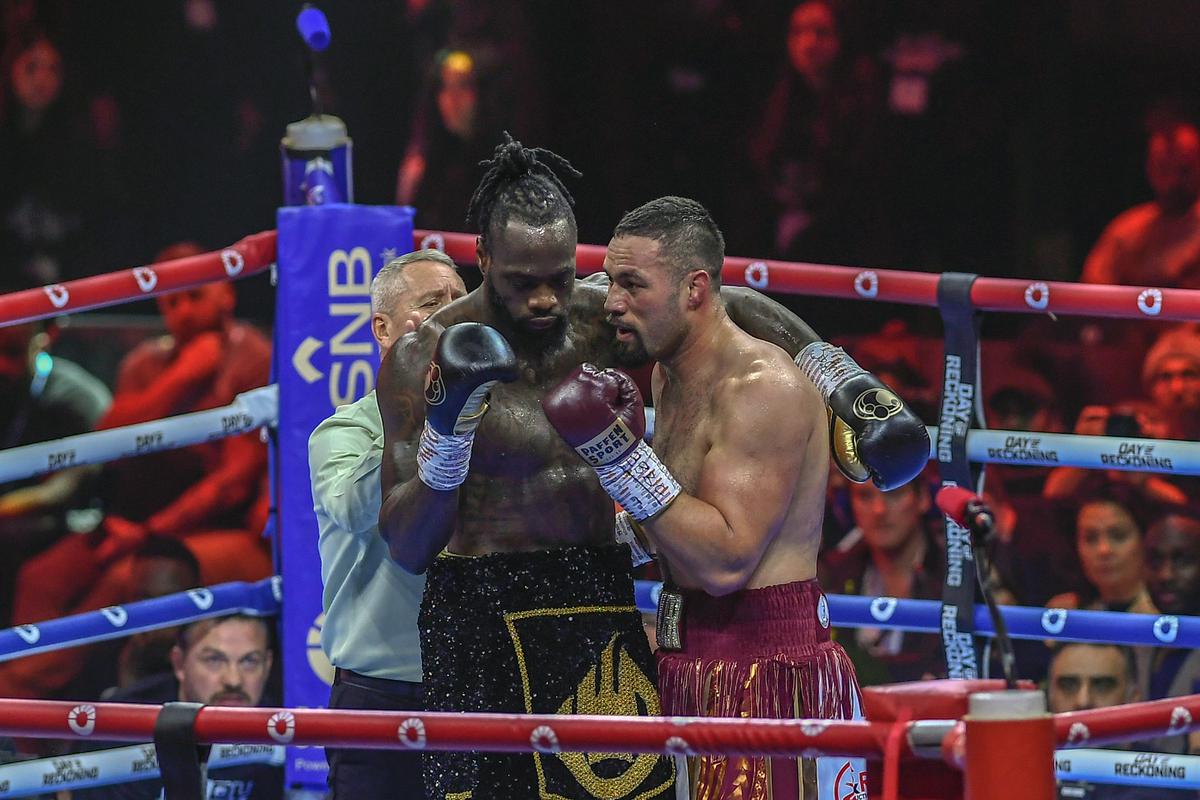 Deontay Wilder, left, chats with Joseph Parker during a boxing match at Kingdom Arena in Riyadh, Saudi Arabia.