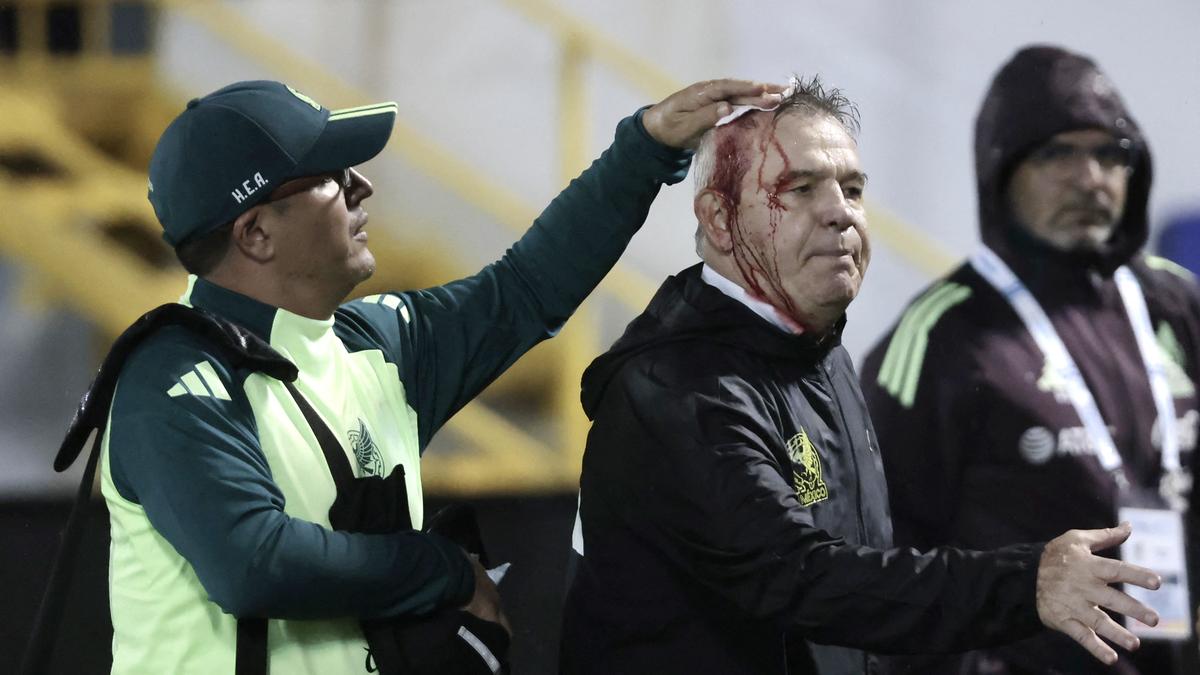 Honduras sanctioned after Mexico coach Aguirre hit by can in CONCACAF Nations League match