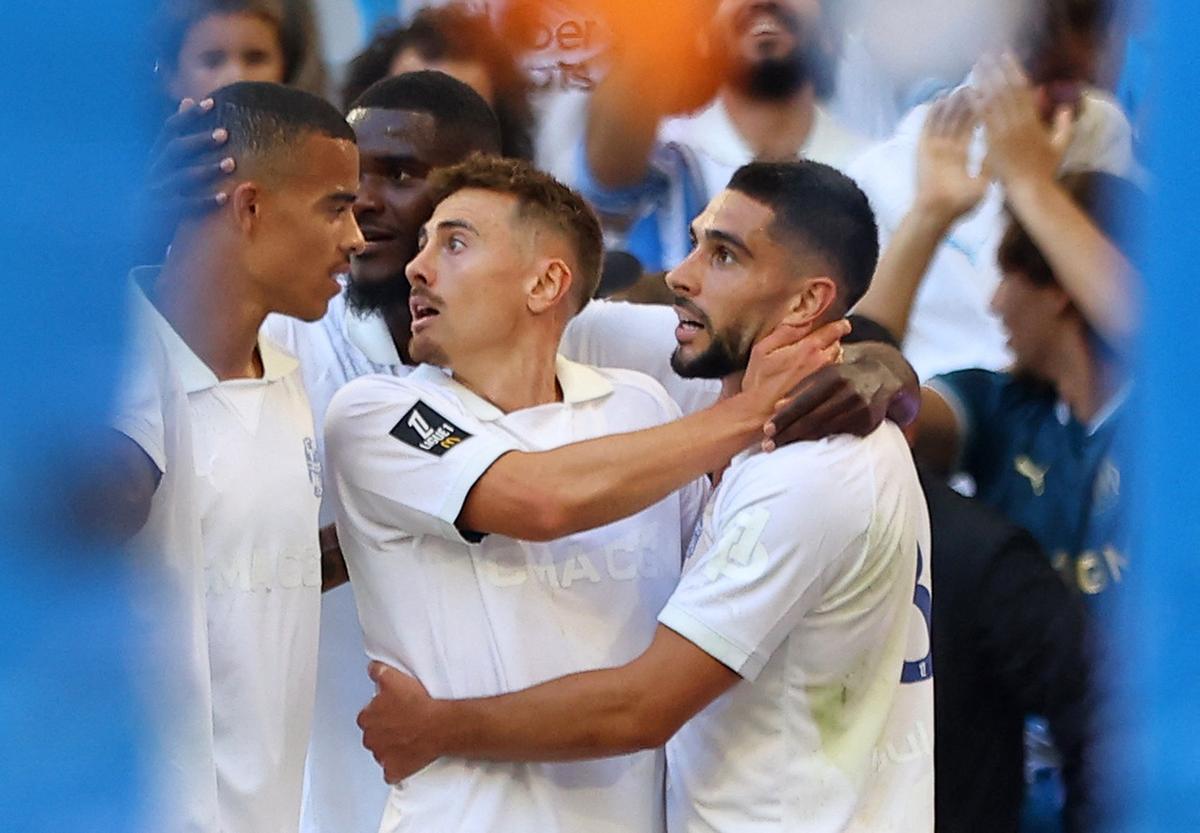 Olympique de Marseille’s Neal Maupay celebrates scoring its first goal against Nice with teammates.