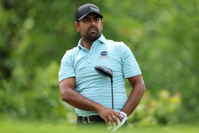 Anirban Lahiri of India watches his shot from the fourth tee during a practice round prior to the 2023 PGA Championship at Oak Hill Country Club.