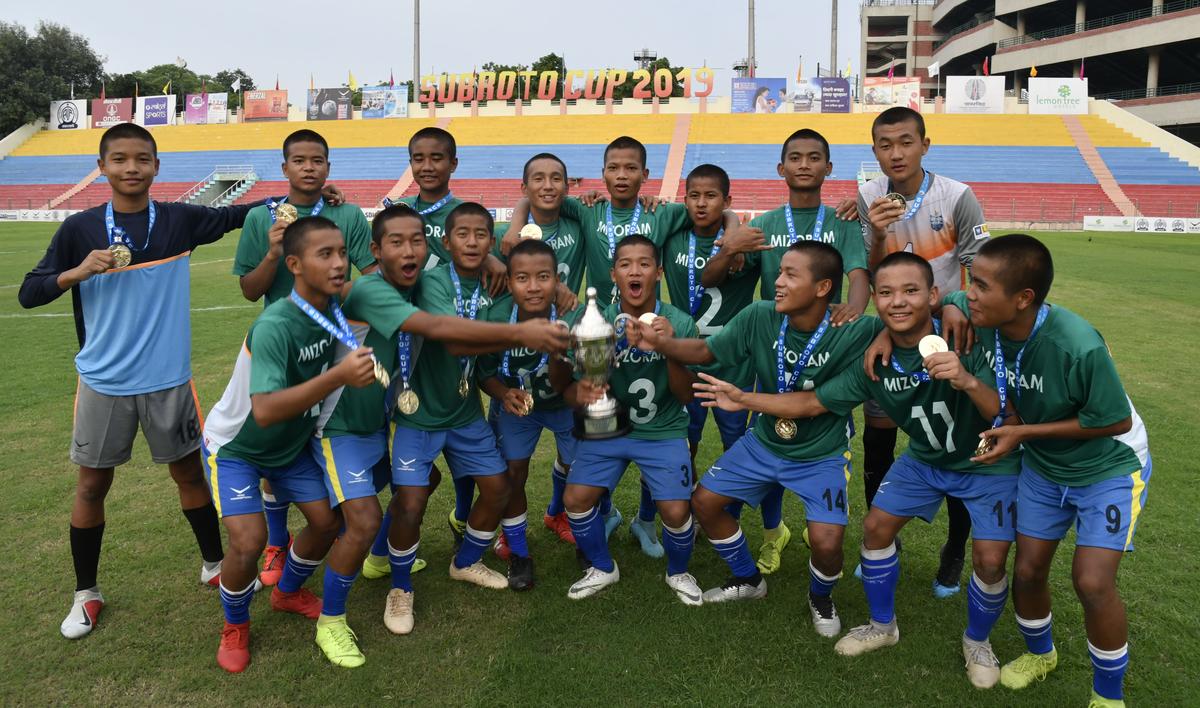 Kolasib Mizoram team celebrates their victory over Unique Model Academy, Manipur in the finals of the (U-14) Subroto Cup international football tournament.