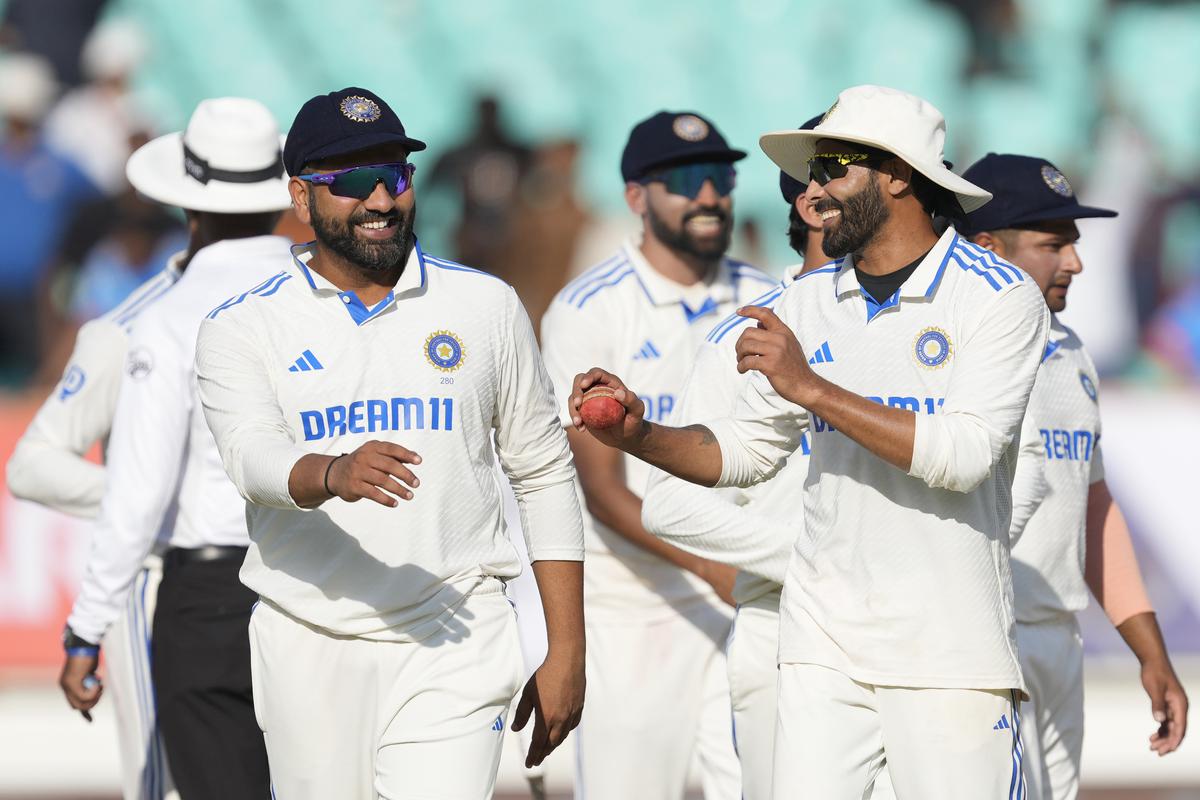 India’s captain Rohit Sharma, left, and teammate Ravindra Jadeja celebrate after India won the third cricket test match against England in Rajkot, India.