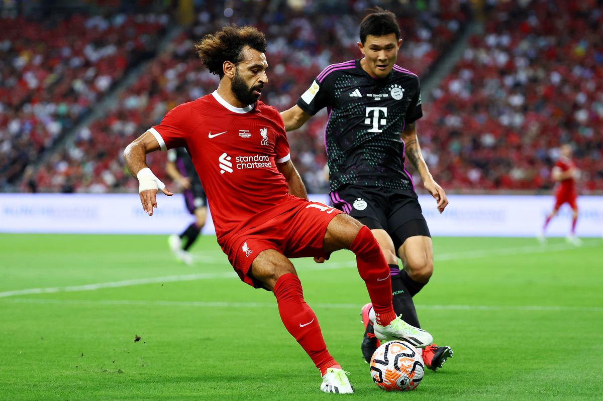 Mohamed Salah of Liverpool controls the ball against Kim Min-jae of Bayern Munich during the first half of the pre-season friendly at the National Stadium in Singapore.