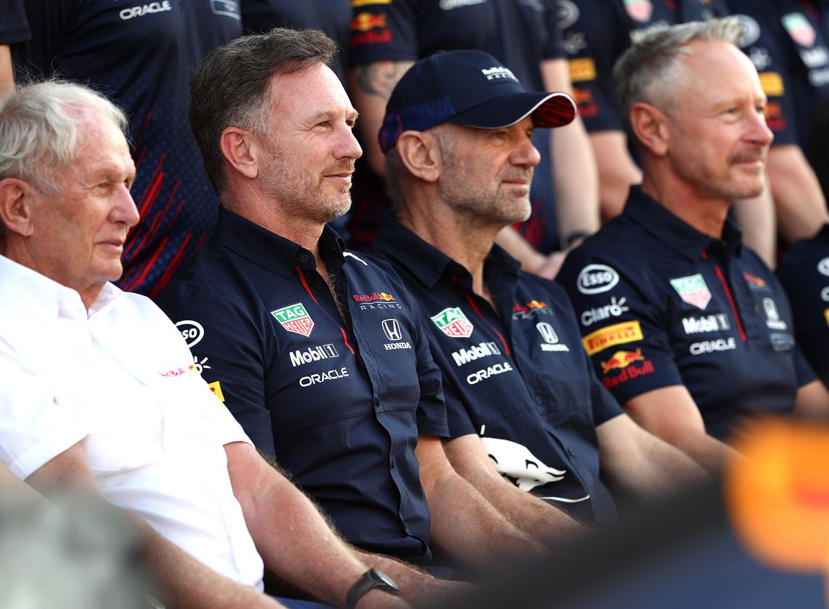 Red Bull Racing Team Principal Christian Horner (second from .left) during a team photo alongside Jonathan Wheatley (extreme right). 