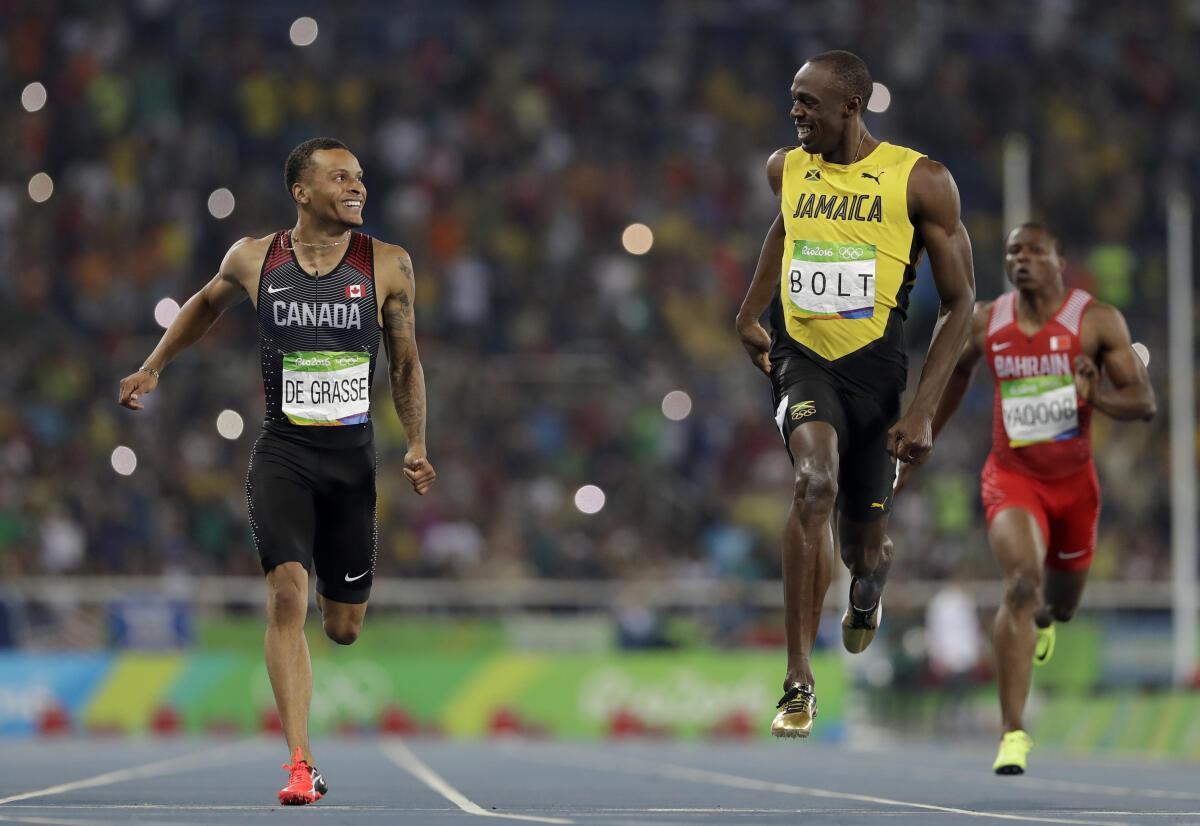 Jamaica’s Usain Bolt, right, and Canada’s Andre De Grasse compete in a men’s 200-meter semifinal during the athletics competitions of the 2016 Summer Olympics.