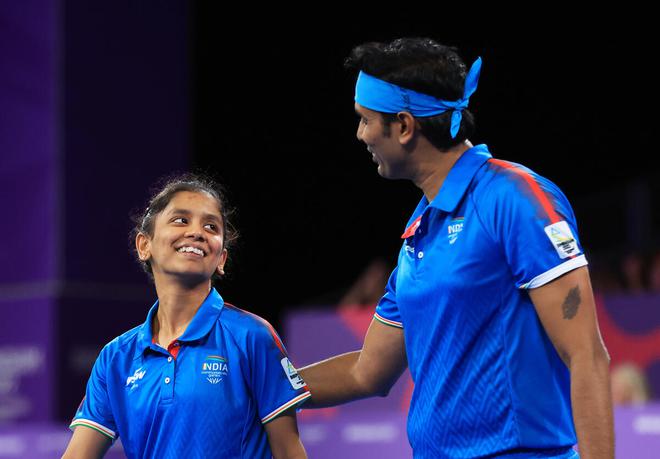 Sharath Kamal Achanta and Sreeja Akula celebrate their victory in the table tennis mixed doubles gold medal match on Sunday. 