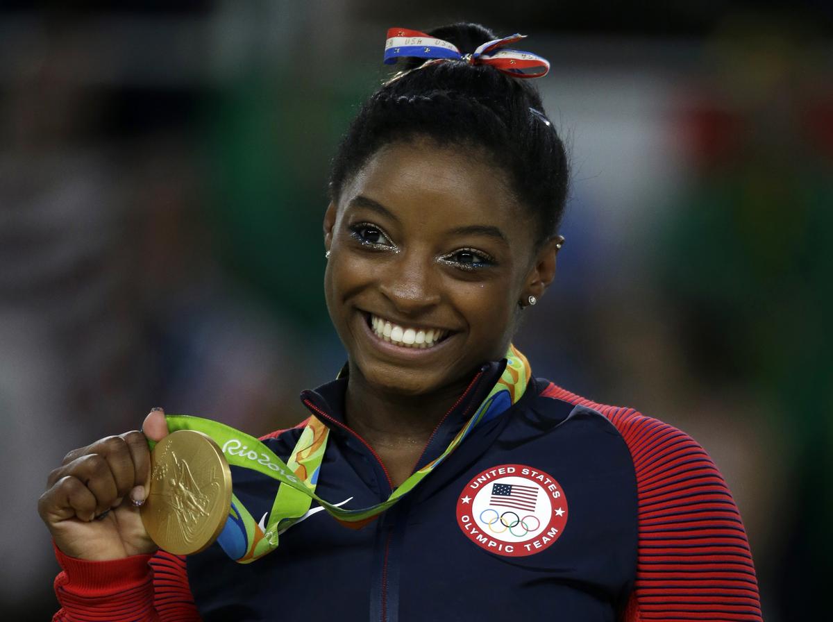 United States’ Simone Biles with  her gold medal for the floor routine at the 2016 Summer Olympics in Rio.