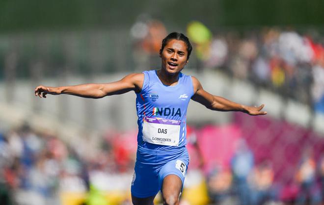 Hima Das reacts as she crosses the finish line in her heat in the Women’s 200m event on Thursday. 
