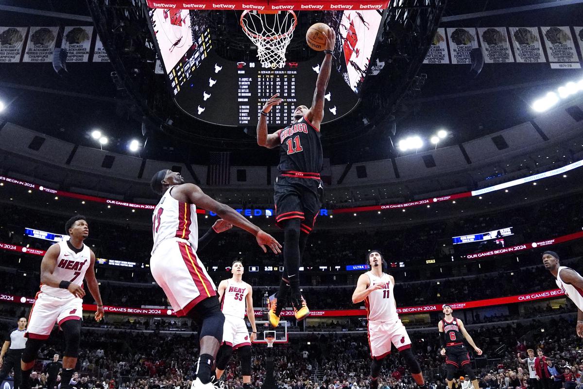 Chicago Bulls forward DeMar DeRozan (11) drives to the basket against the Miami Heat during the second half of an NBA basketball game in Chicago.