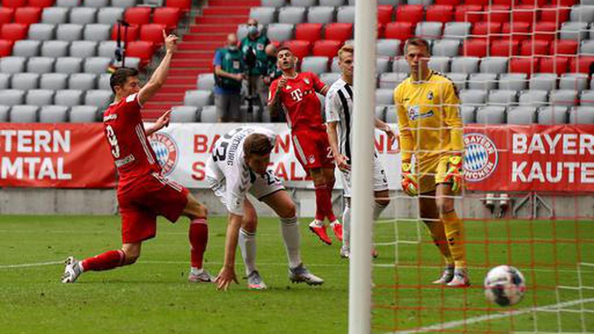 Lewandowski makes history as Bayern Munich beats Freiburg 3-1