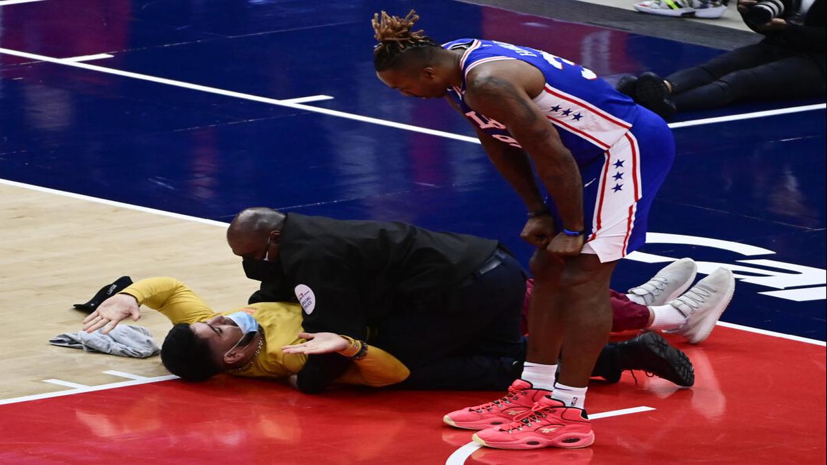 NBA fan runs onto court during Wizards-76ers playoff game