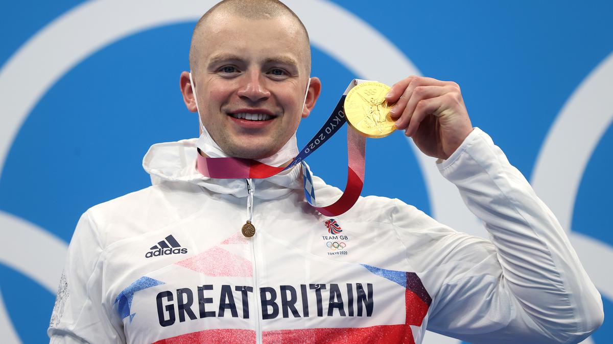 Adam Peaty wins Great Britain's first gold in 100m breaststroke to defend Olympic title