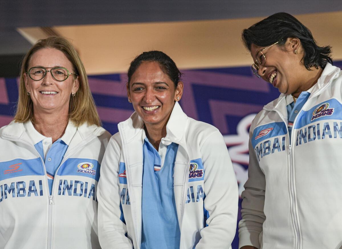 From left, Mumbai Indians’ head coach Lisa Keightley, captain Harmanpreet Kaur and mentor Jhulan Goswami during the Women’s Super League’s pre-season press conference in Mumbai. 