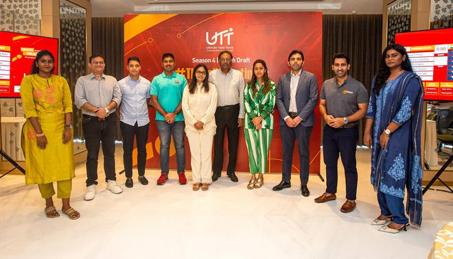 UTT co-promoters Niraj Bajaj and Vita Dani (C) pose with the team owners at the Season 4 coach draft in Mumbai.