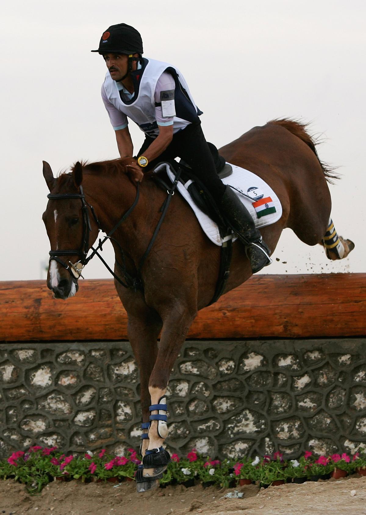 Bhagirath Singh of India rides Guddu in action at the Equestrian Cross Country Event at Sport City during the 15th Asian Games Doha 2006 on December 7, 2006 in Doha, Qatar.  