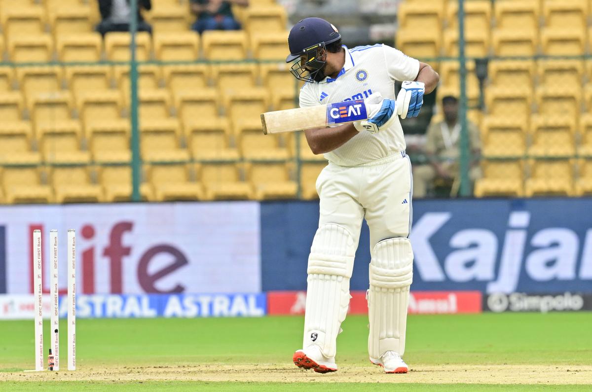 India captain Rohit Sharma sees the woodwork break behind him.