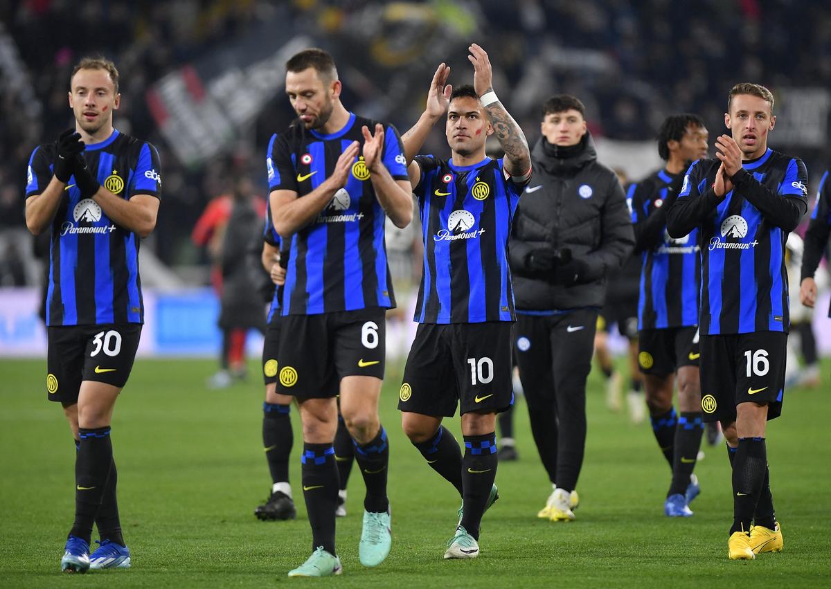 Inter Milan’s Carlos Augusto, Stefan de Vrij, Lautaro Martinez and Davide Frattesi applaud fans after the match.