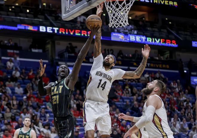 Charlotte Hornets forward JT Thor (21) shoots as New Orleans Pelicans forward Brandon Ingram (14) defends in the second half of an NBA basketball game.