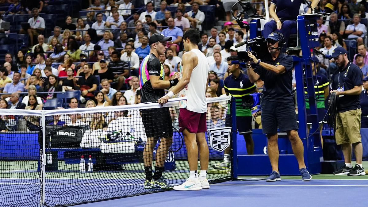 US Open 2023: Defending champion Alcaraz advances as injured Koepfer retires