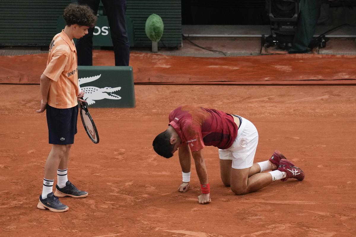 A ball kid came to the aid of Serbia’s Novak Djokovic after he slipped and fell during his fourth round match of the French Open tennis tournament against Argentina’s Francisco Cerundolo.