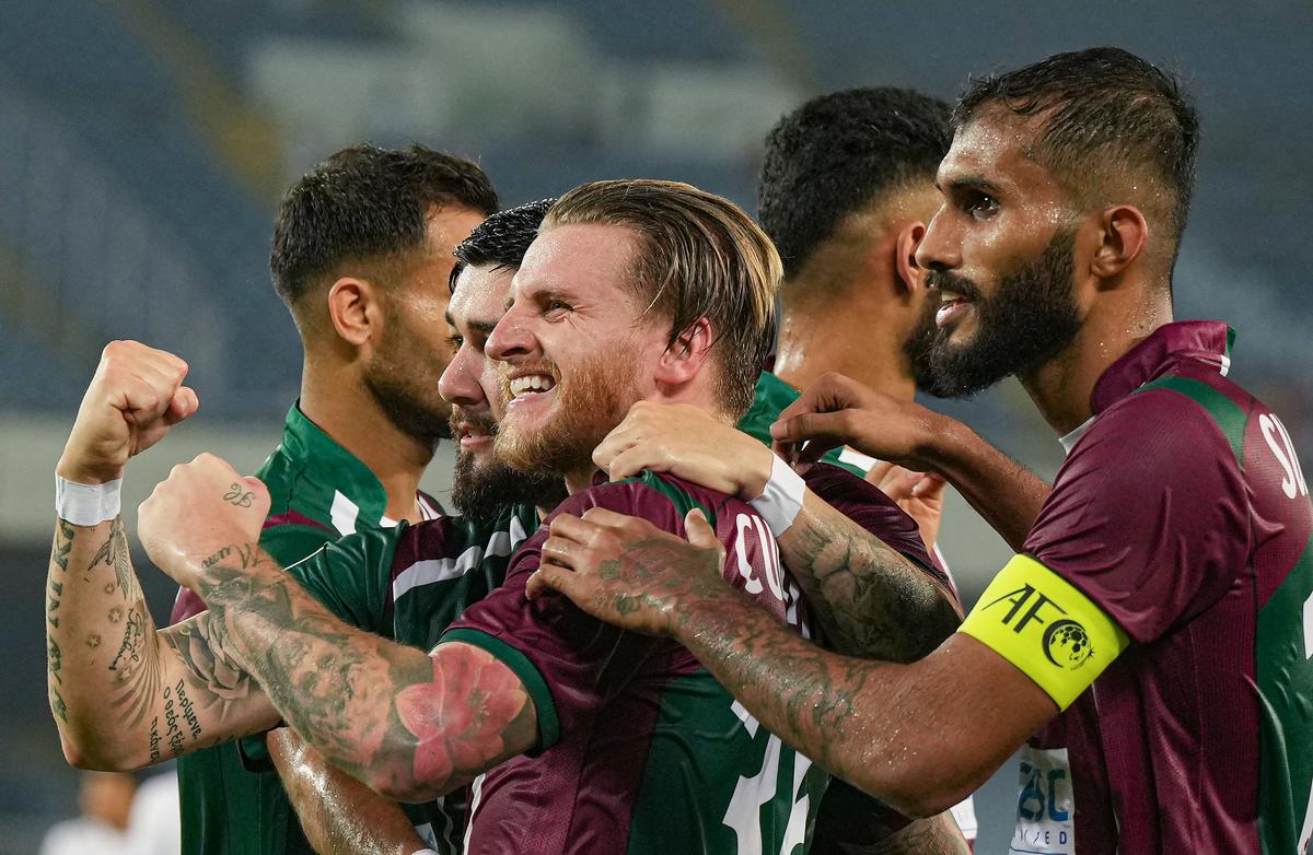 FILE PHOTO: Mohun Bagan Super Giant forward Jason Cummings with his teammates celebrate after scoring a goal against Machhindra FC.
