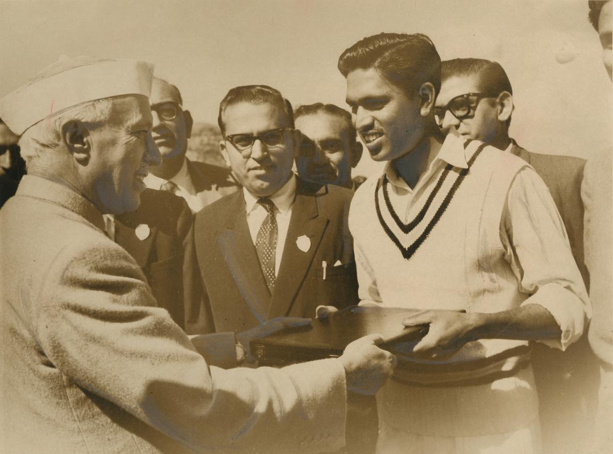 The Prime Minister of India, Mr. Jawaharlal Nehru, hands a silver plate to Chandu Borde, who had the distinction of scoring the only Test century against the Tourists, before commencement of play on third day of the fifth Test match between India and West Indies at the then Feroze Shah Kotla ground in New Delhi.