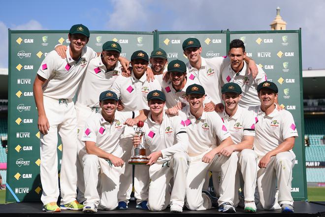 The Australian team poses with the Frank-Worrell Trophy after winning the series against West Indies 2-0. 