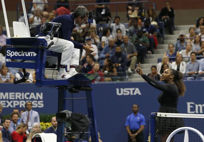 FILE PHOTO: Serena Williams with chair umpire Carlos Ramos while playing Naomi Osaka during the 2018 US Open women’s singles final on September 8, 2018 in New York. Osaka, 20, triumphed 6-2, 6-4 in the match marred by Williams’ second set outburst, the American enraged by umpire Carlos Ramos’s warning for receiving coaching from her box. She tearfully accused him of being a “thief” and demanded an apology from the official.