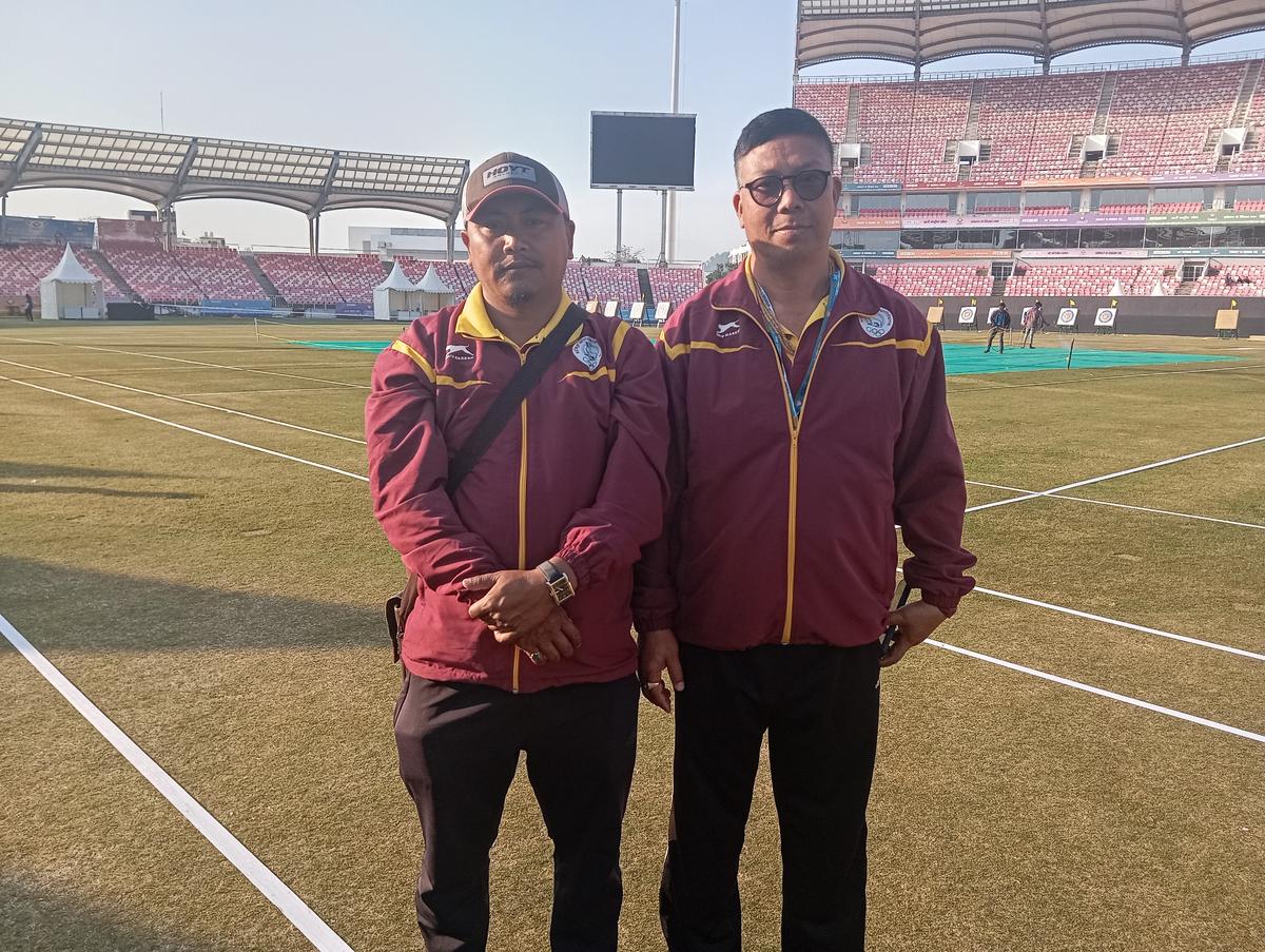 Manipur archery team coach Bijendranath Singh with manager Premkumar Sharma.