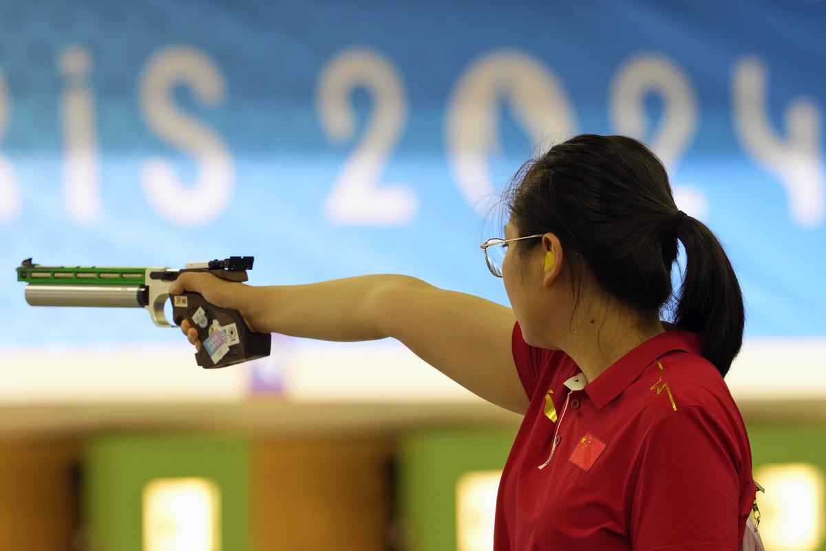 China’s Jiang Ranxin takes aim during the 10m Air Pistol Women’s Pre-event Training at the 2024 Summer Olympics.