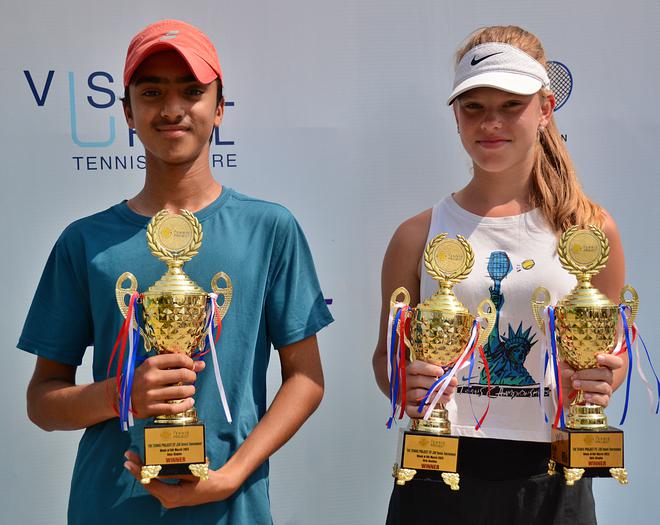 Boys and Girls title winners, Vihaan Reddy and Ariana Gogulina, at the ITF junior tennis tournament in Gurugram.