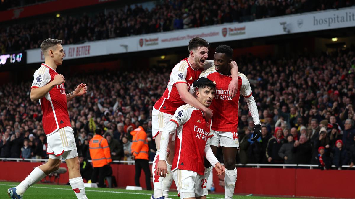 Soccer-Arsenal move top of the league with 2-0 win over Brighton