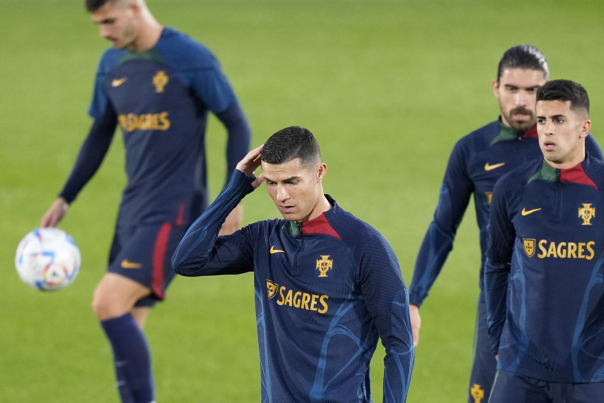 Portugal's Cristiano Ronaldo heads the ball during a team training