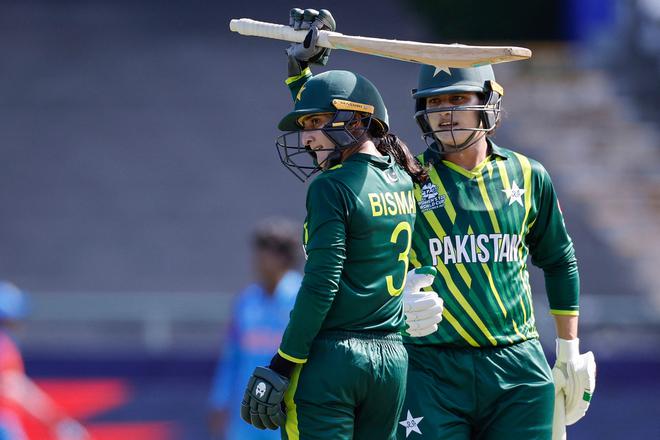 Pakistan’s Bismah Maroof (L) celebrates after scoring a half-century (50 runs) as Pakistan’s Ayesha Naseem (R) looks on 