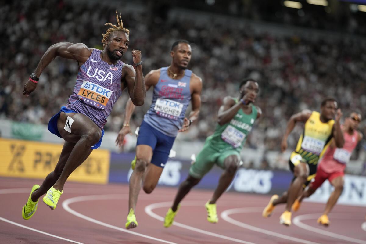 Noah Lyles competes in the men’s 200 meters heats at the World Athletics Championships in Tokyo. 