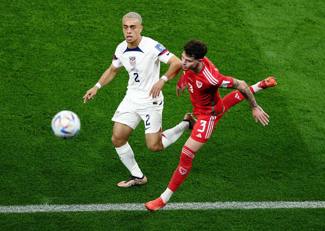 Sergino Dest of the U.S. in action with Wales’ Neco Williams at the Ahmad Bin Ali Stadium, Al Rayyan, Qatar.