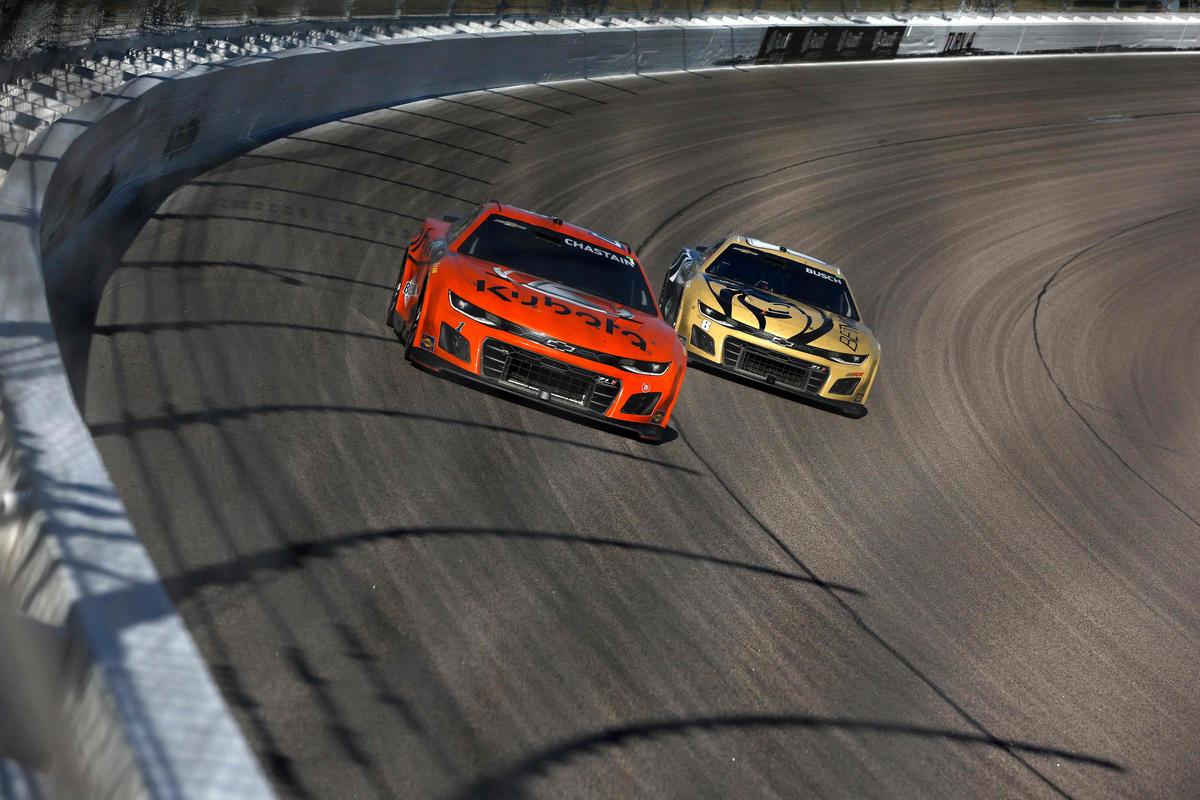 Ross Chastain, driver of the #1 Kubota Chevrolet, and Kyle Busch, driver of the #8 BetMGM Chevrolet, race during the NASCAR Cup Series Hollywood Casino 400.