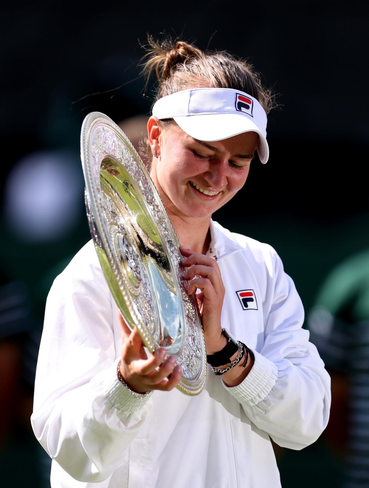 A beaming Krejcikova with the Wimbledon trophy.